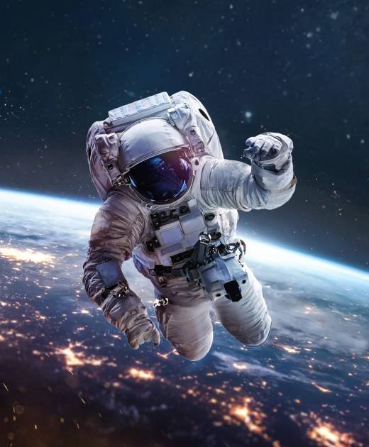 Astronaut on orbit of Earth in the outer space. Abstract wallpap